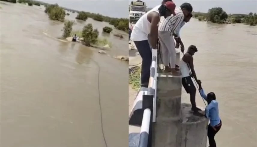 امرأة تدفع زوجها في المياه خلال التقاط صورة