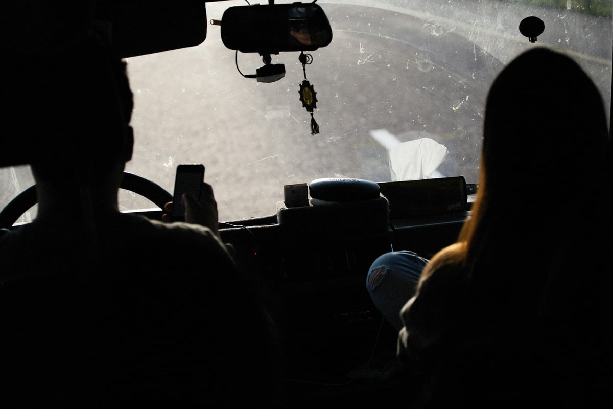 a view from inside a vehicle of a street